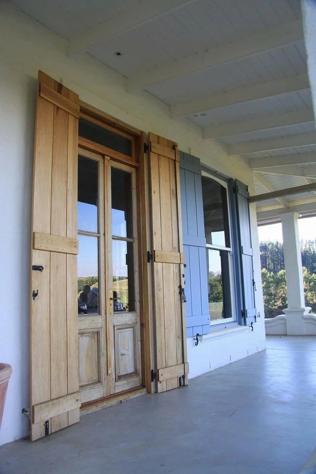 Double volume doors and shutters at Oneiric homestead, Elgin, South Africa