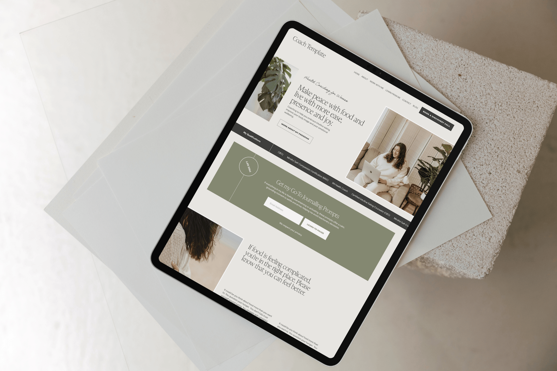 Tablet displaying a health coach Squarespace website design featuring black, beighe and autumnal colour palette with sections for her services and specialisations and a top header with a call to action, created by an Auckland Squarespace Website Des