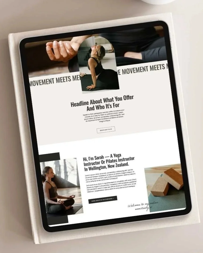Tablet on a textured white book displays a Yoga Teacger Squarespace Website Template with photos, text boxes, and info sections.