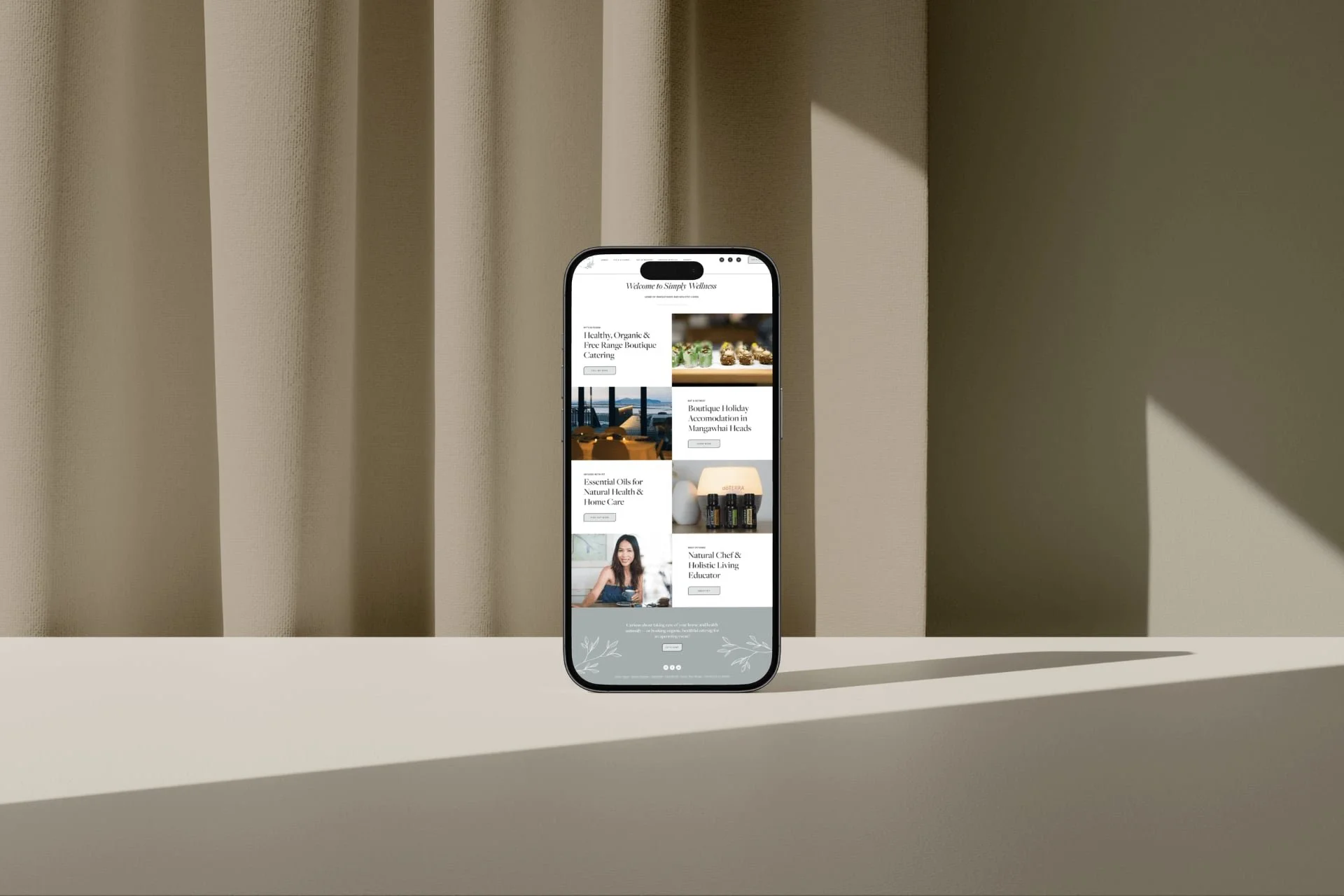 Auckland Health Coach and Wholefood Caterer Squarespace website homepage displayed on a mobile phone
