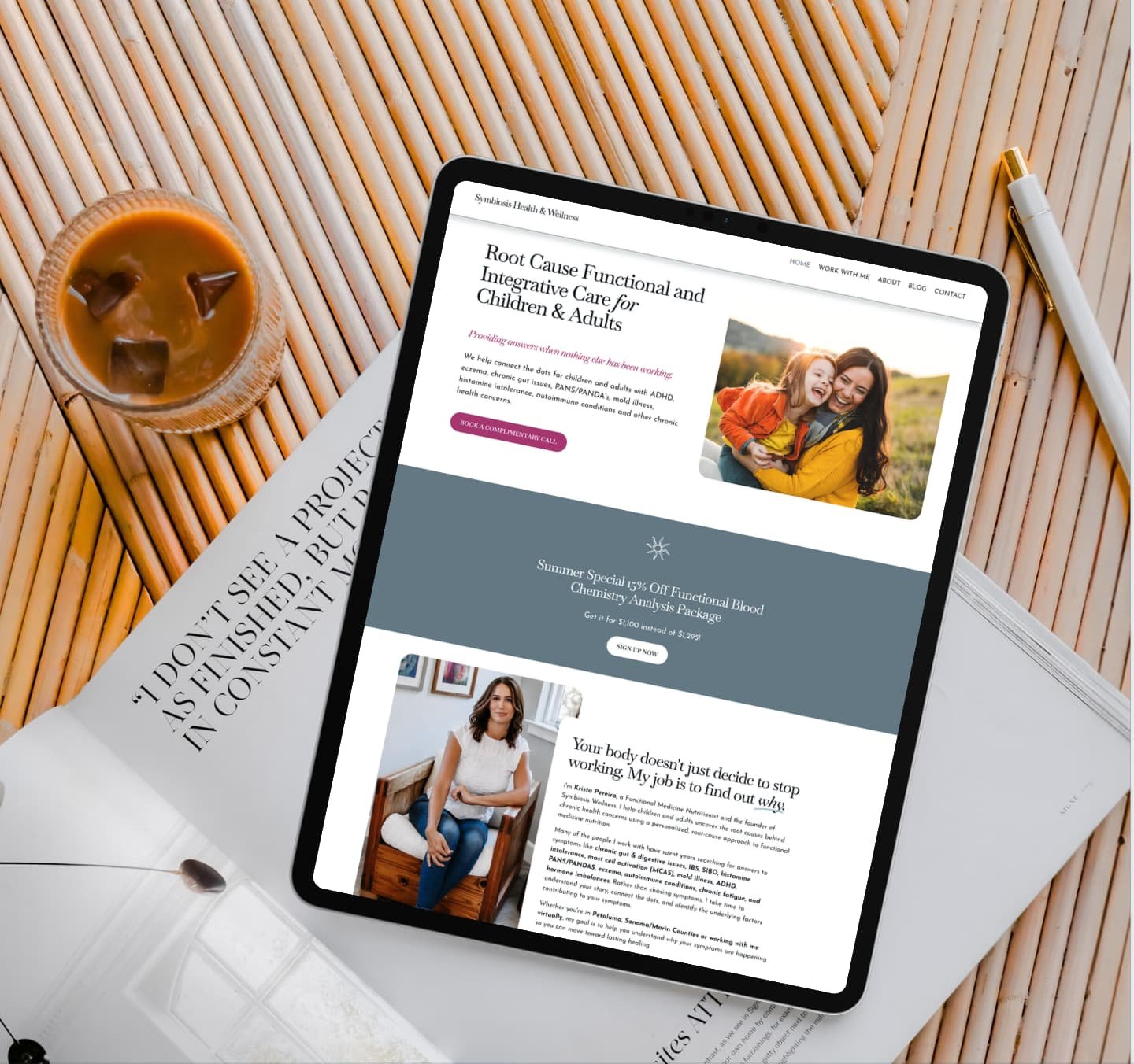 A tablet on a wooden table displays a nutritionist Squarespace website design with photos of a woman, a child, and text about functional medicine.