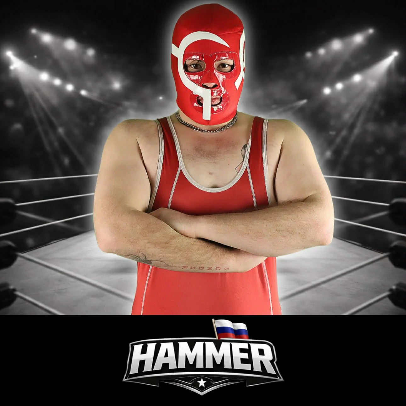 A wrestler in a red mask and singlet standing with arms crossed in a wrestling ring, with a spotlighted arena background and a 'HAMMER' logo at the bottom.