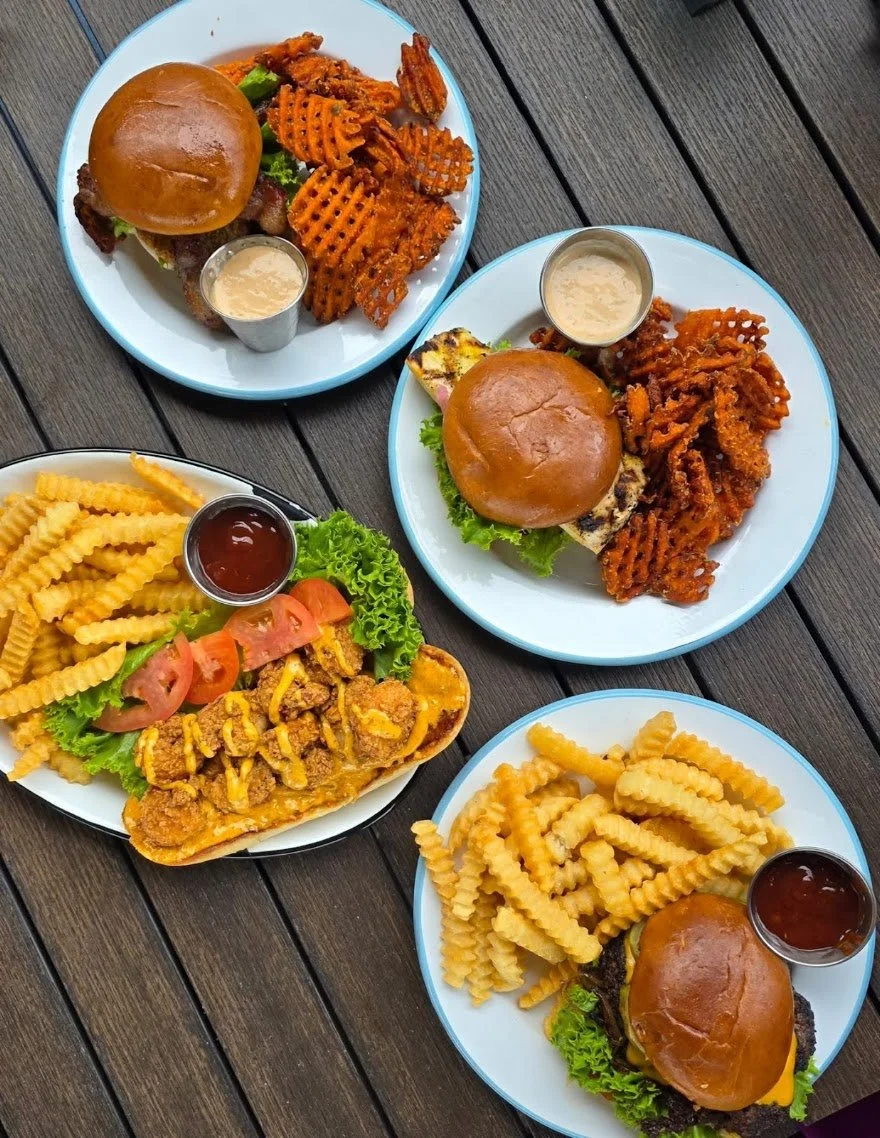 A selection of burgers, sandwiches, chicken, and fries served fresh at The Fillin' Station.
