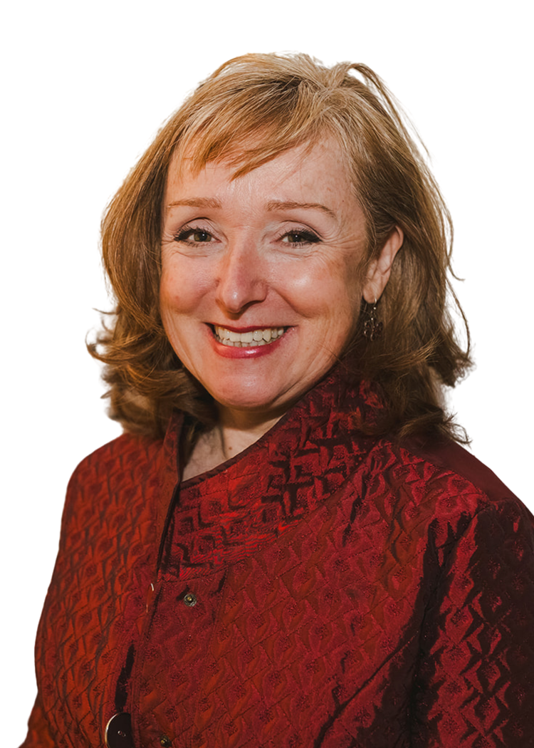 A smiling woman with shoulder-length light brown hair, wearing a red textured jacket