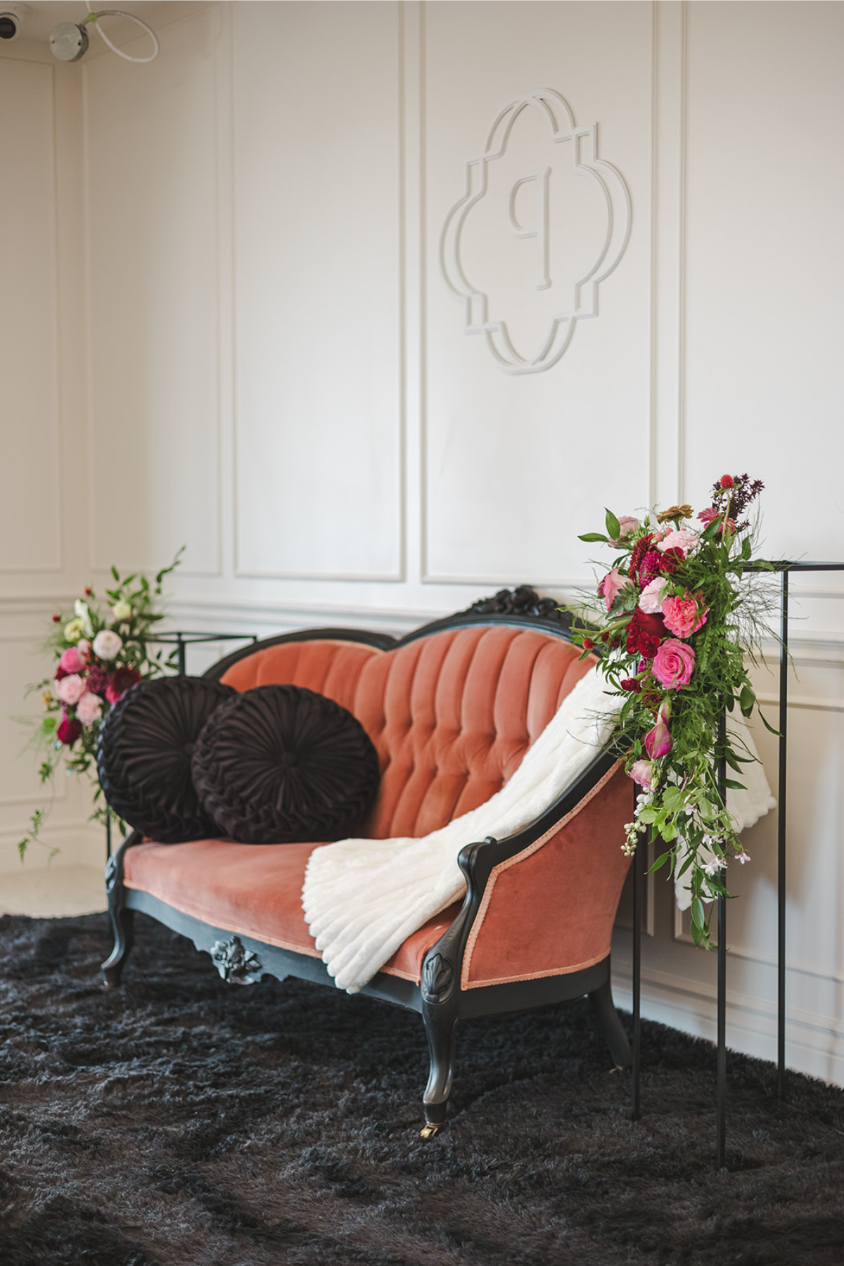 Vintage peach and black couch at branding photoshoot