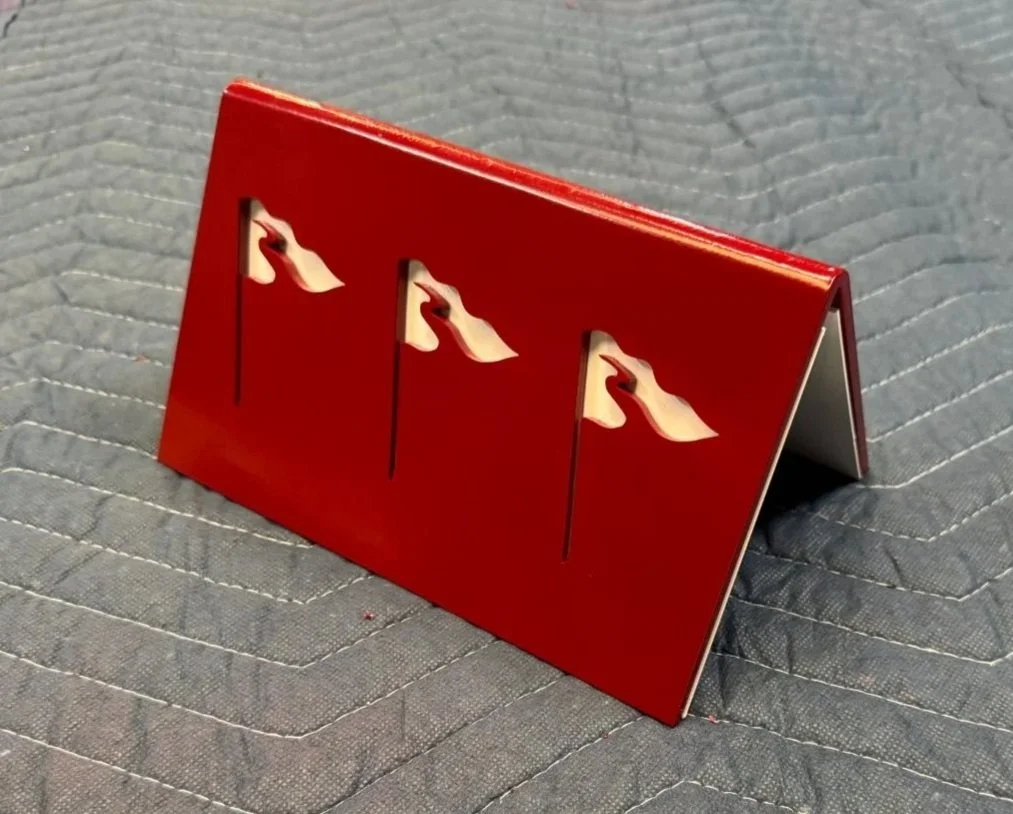 These custom tee box markers feature a clean, cut-steel design with a bold, simple profile. Built for outdoor use, they add a durable and polished detail to the course. 