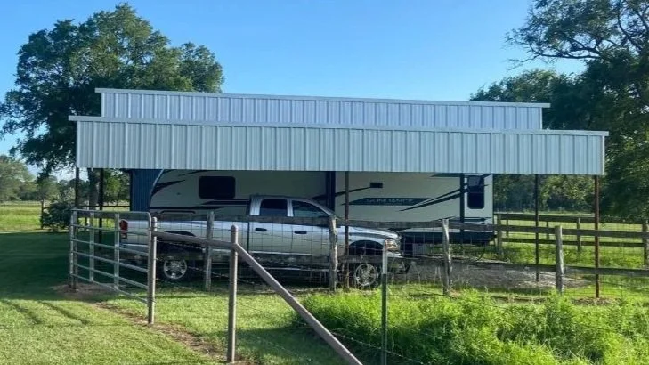 This 24' × 36' RV cover with a 36' × 10' lean-to features a spacious main bay designed to protect full-size RVs. The attached lean-to offers additional covered space for vehicles, trailers, or storage. 