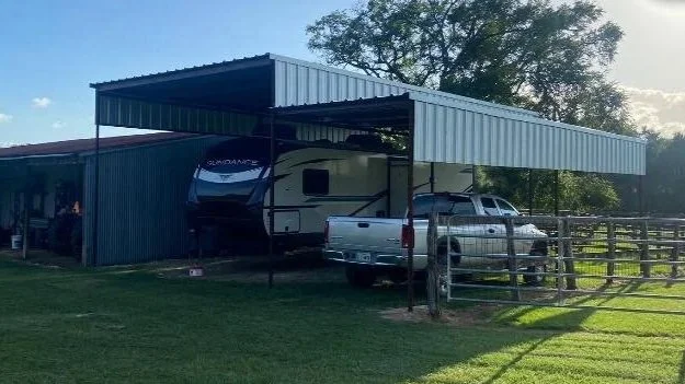 This 24' × 36' RV cover with a 36' × 10' lean-to features a spacious main bay designed to protect full-size RVs. The attached lean-to offers additional covered space for vehicles, trailers, or storage.