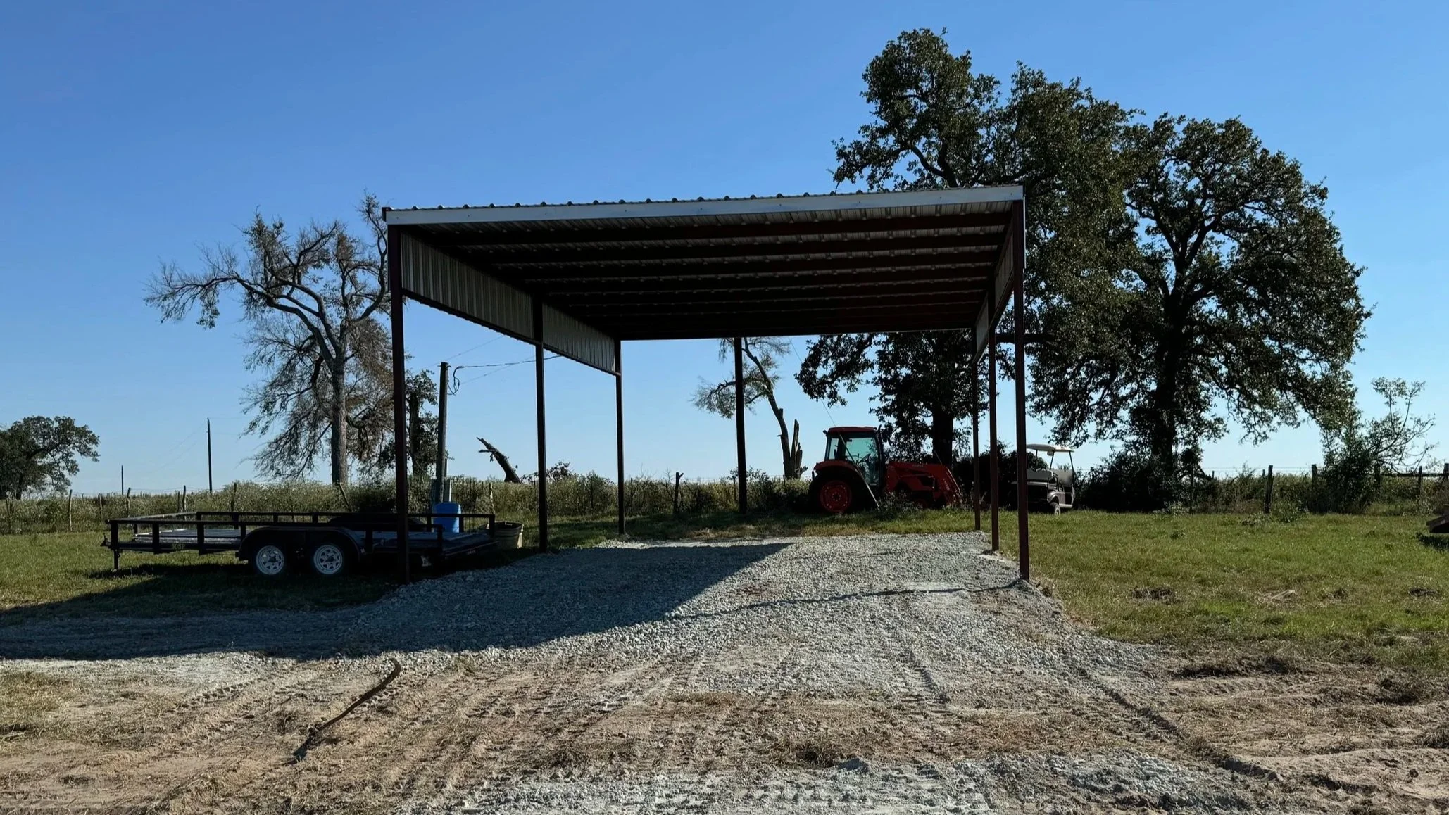This 24' × 36' RV and equipment cover features a sturdy steel frame and open layout, offering reliable protection for vehicles, trailers, and equipment. 