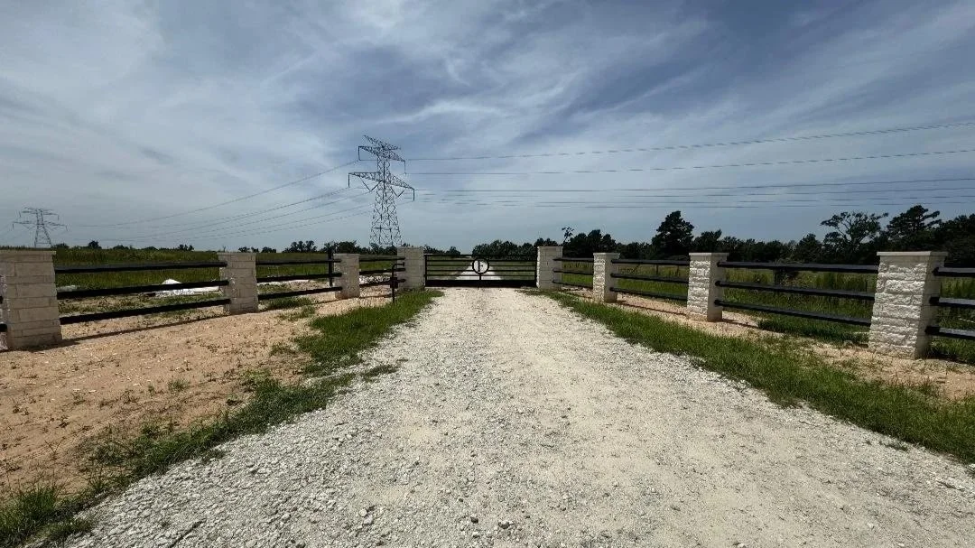 This custom entrance features brick columns paired with a 16' sliding gate for a clean, timeless look. The combination of masonry and steel provides both durability and visual appeal. 
