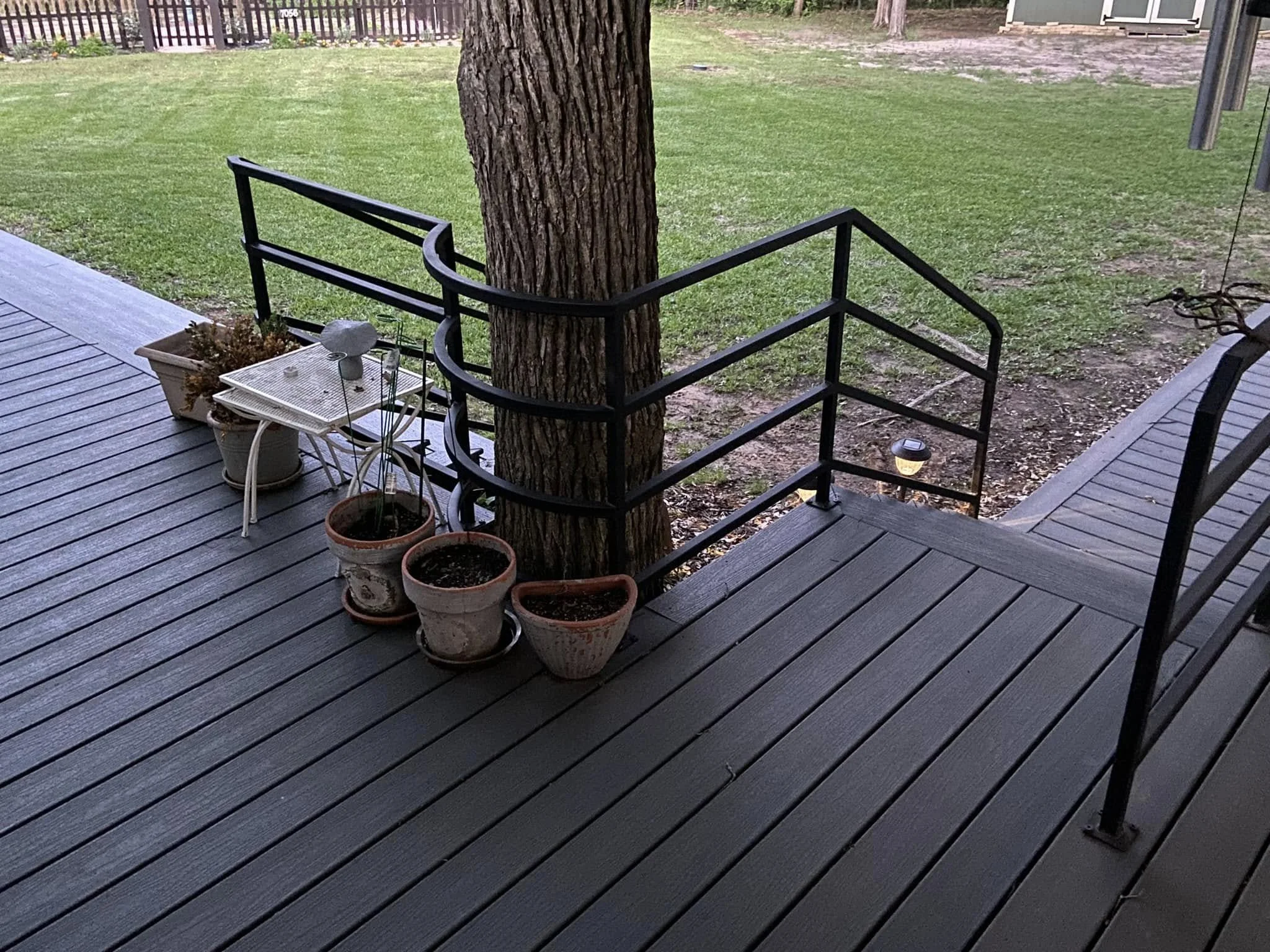 This porch guardrail was custom fit around existing features for a clean, seamless look. The design offers security while keeping the area open and inviting. 