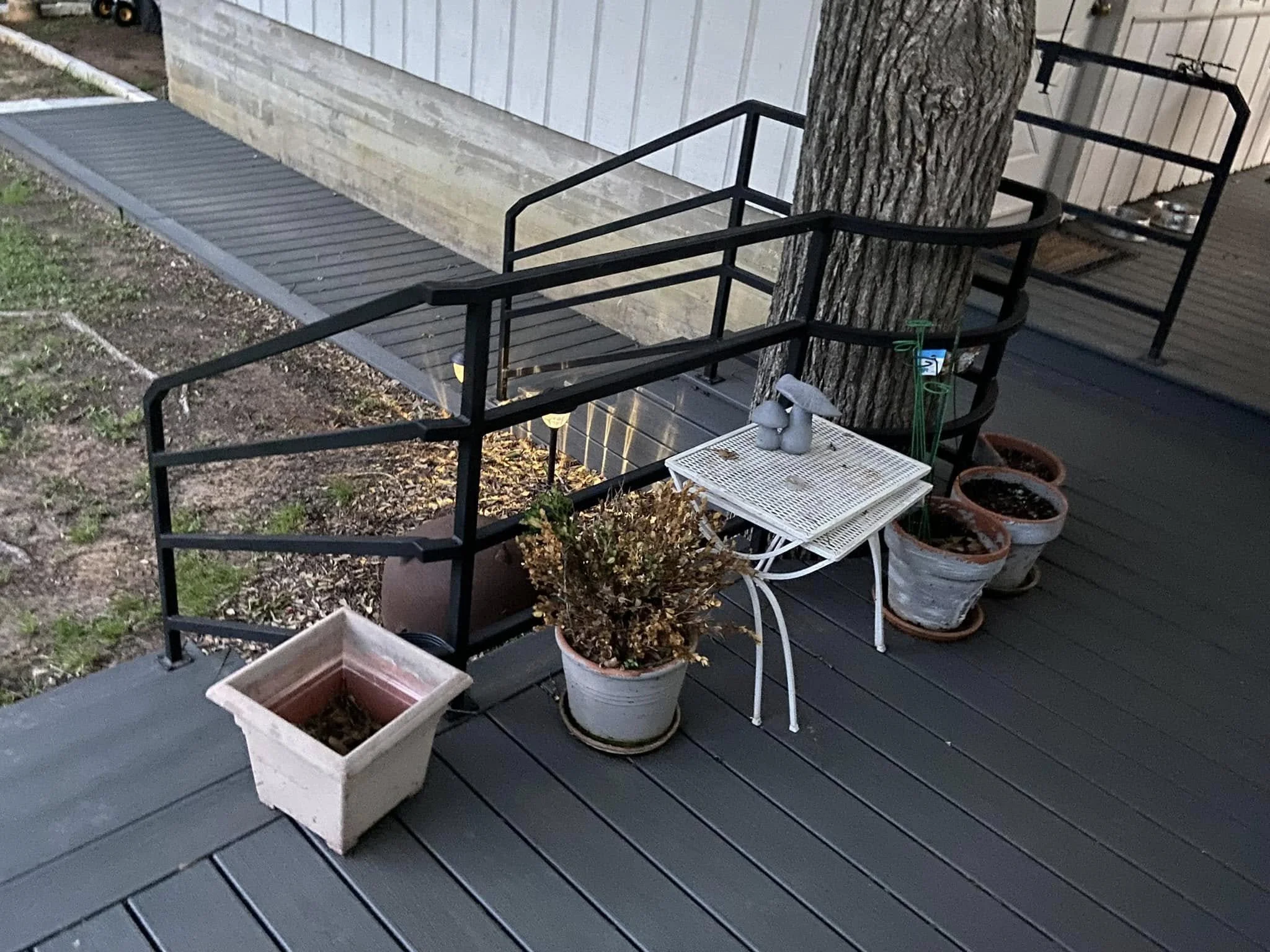 This porch guardrail was custom fit around existing features for a clean, seamless look. The design offers security while keeping the area open and inviting. 