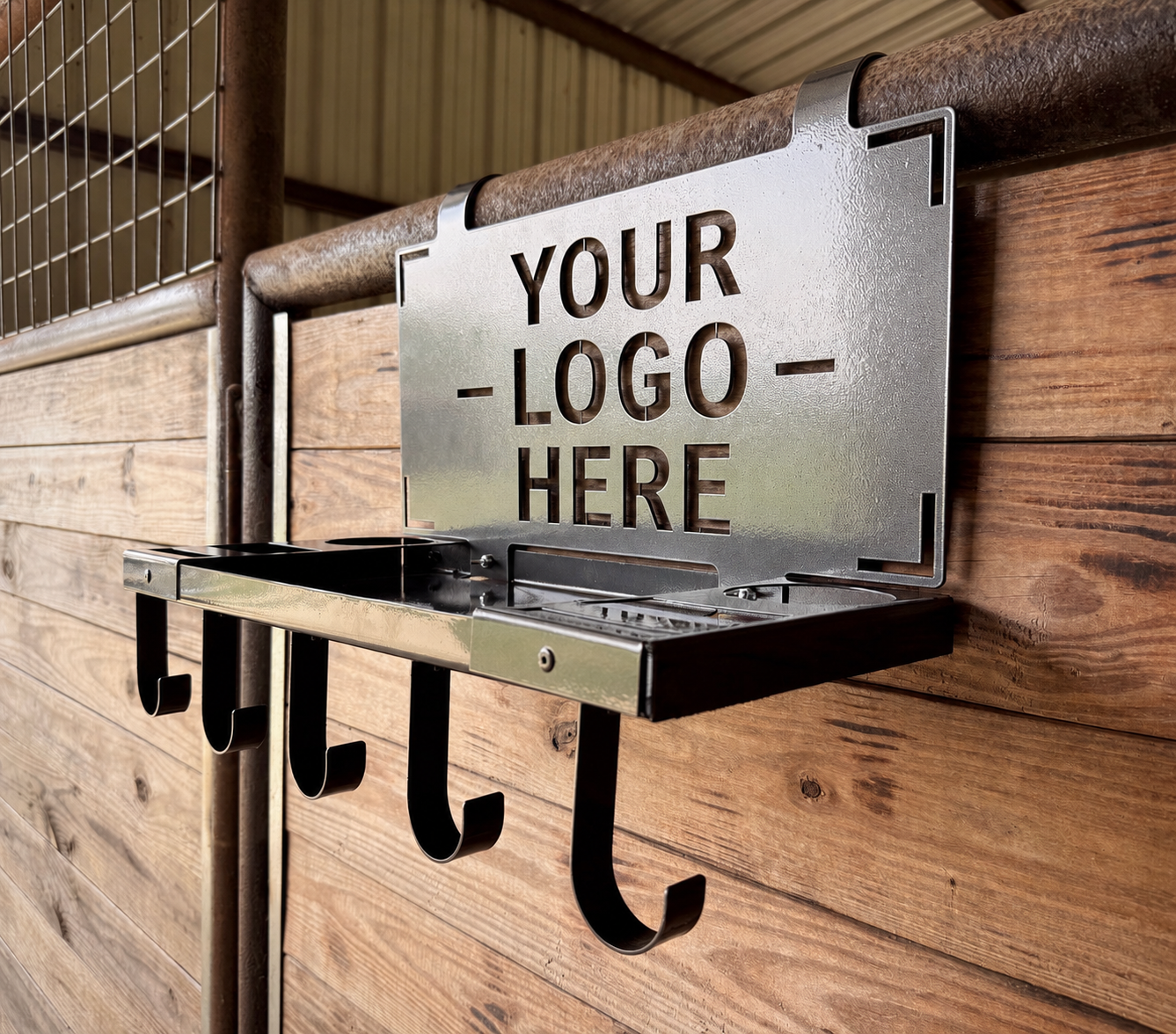 A metal sign with cutout letters that reads 'Your Logo Here' attached to a wooden wall with hooks below it.