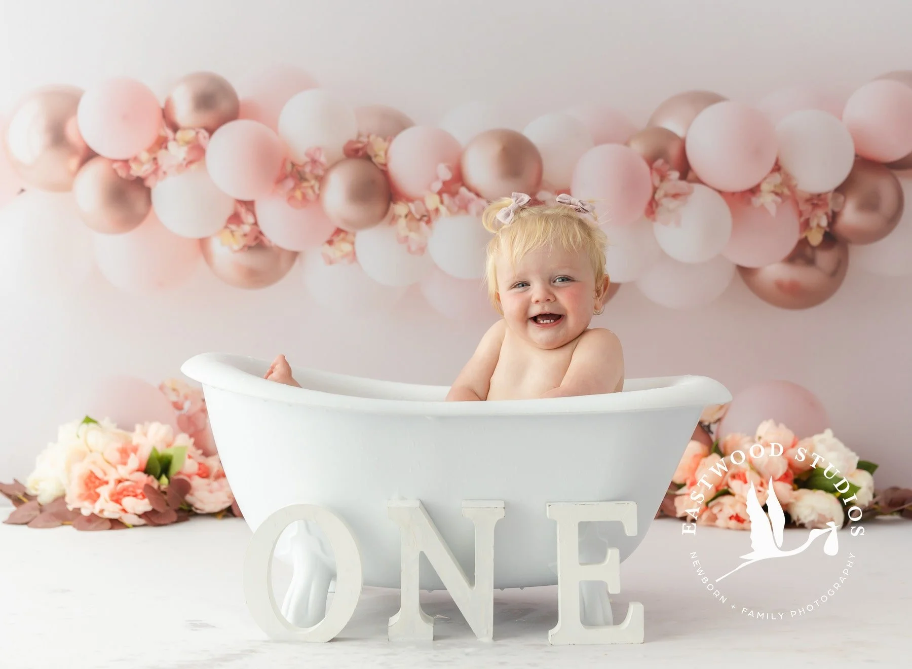 Fun bubble bath clean up for baby after cake smash milestone session in Canterbury NZ