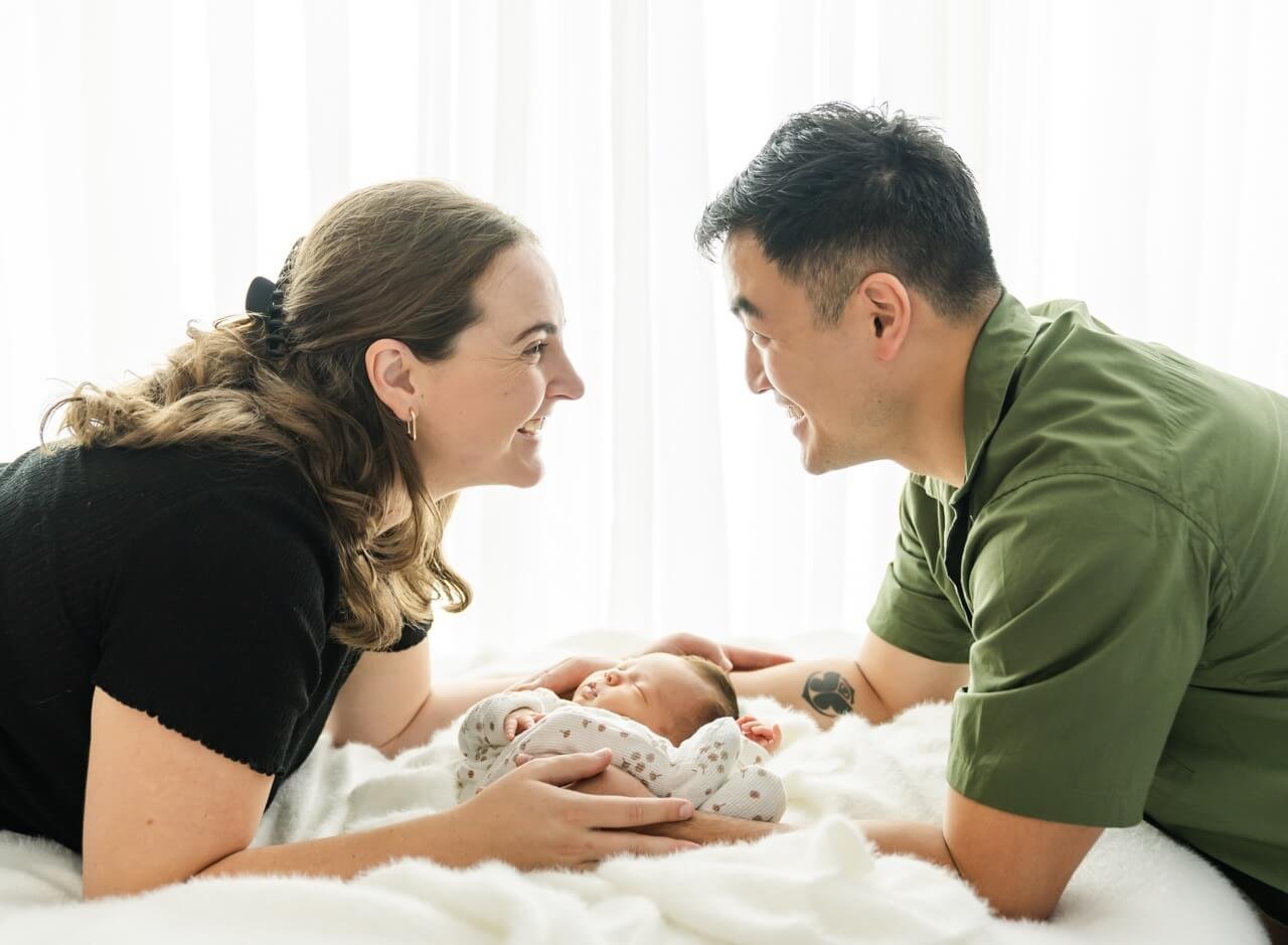 Happy new parents and newborn at photography session Bishopdale Christchurch