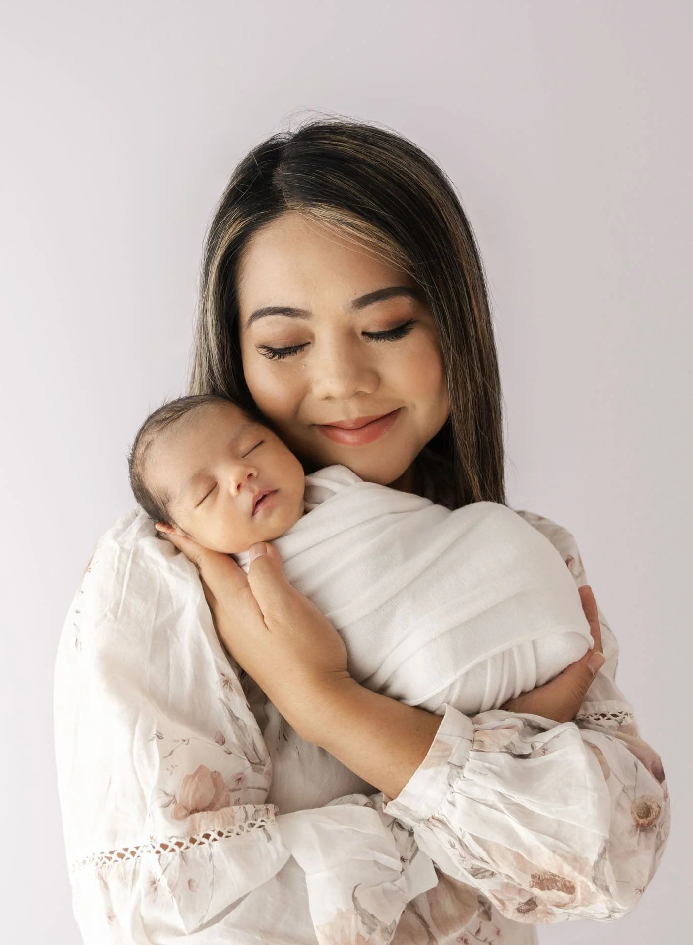Family connection portrait of mother with newborn baby in Christchurch studio