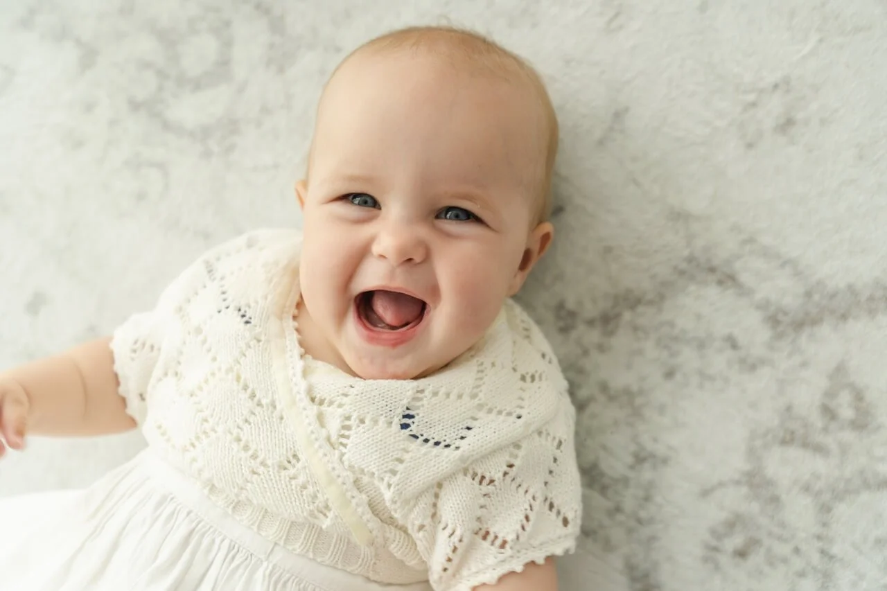 Adorable smiling baby milestone portrait at Christchurch studio
