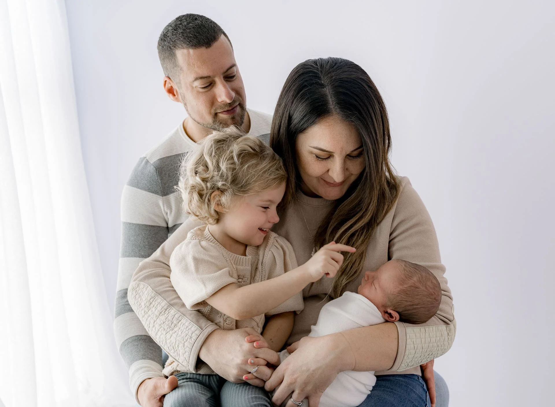 Parents and sibling with Newborn during family portrait session Christchurch photographer