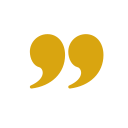 A pair of gold quotation marks on a black background.