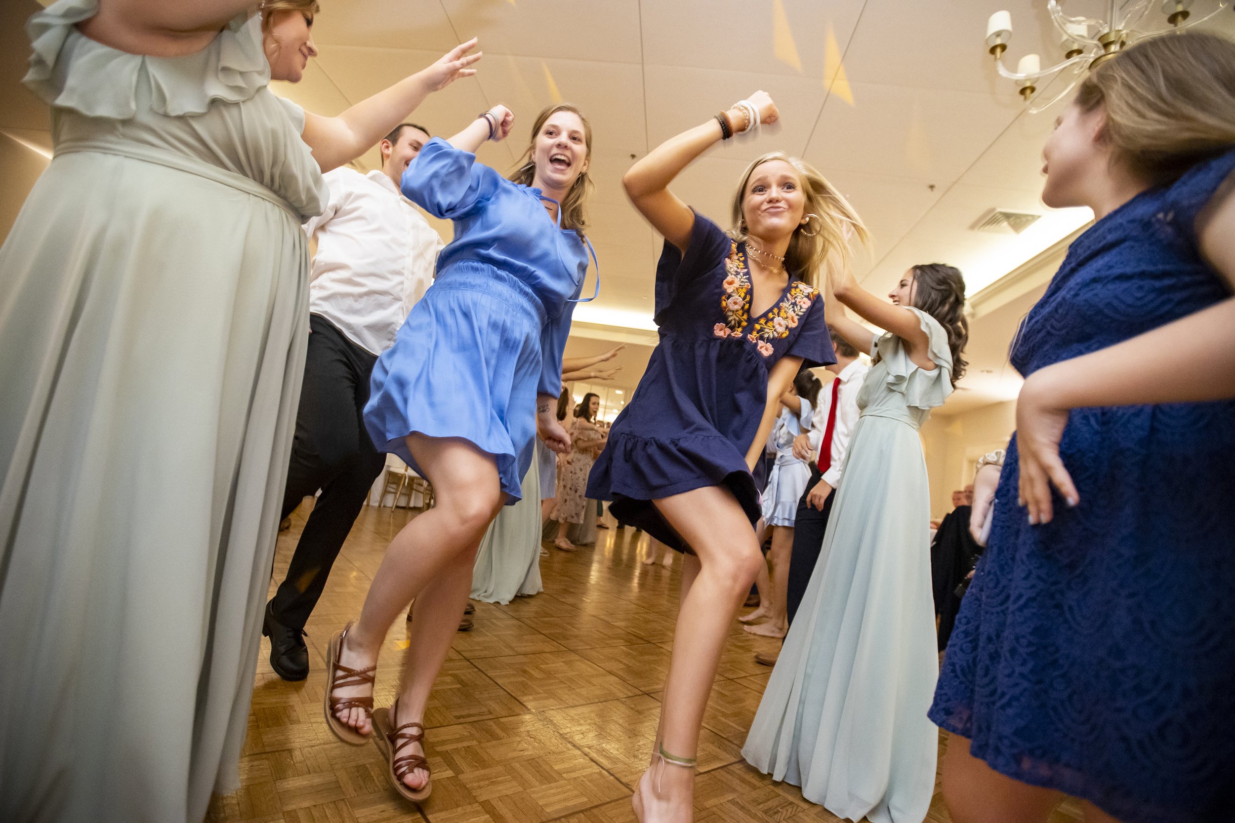 Group of young people dancing and having fun at a party or celebration.