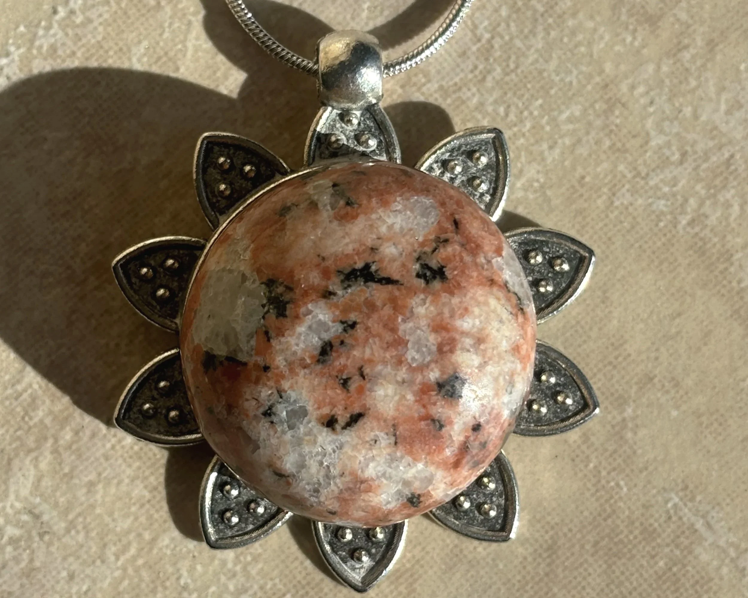 Elegant Stone Pendant on Silver Flower Bezel