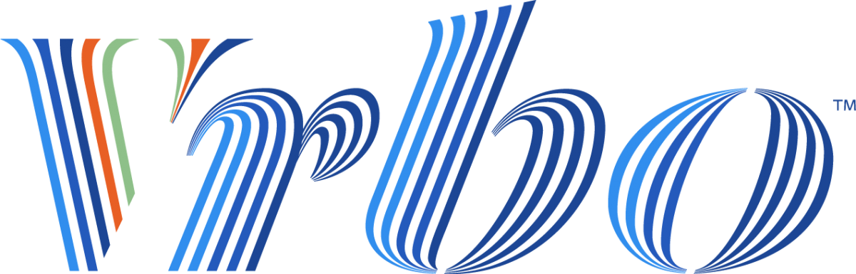 Close-up of the American Airlines logo on an aircraft, featuring a stylized eagle with red, white, and blue colors.