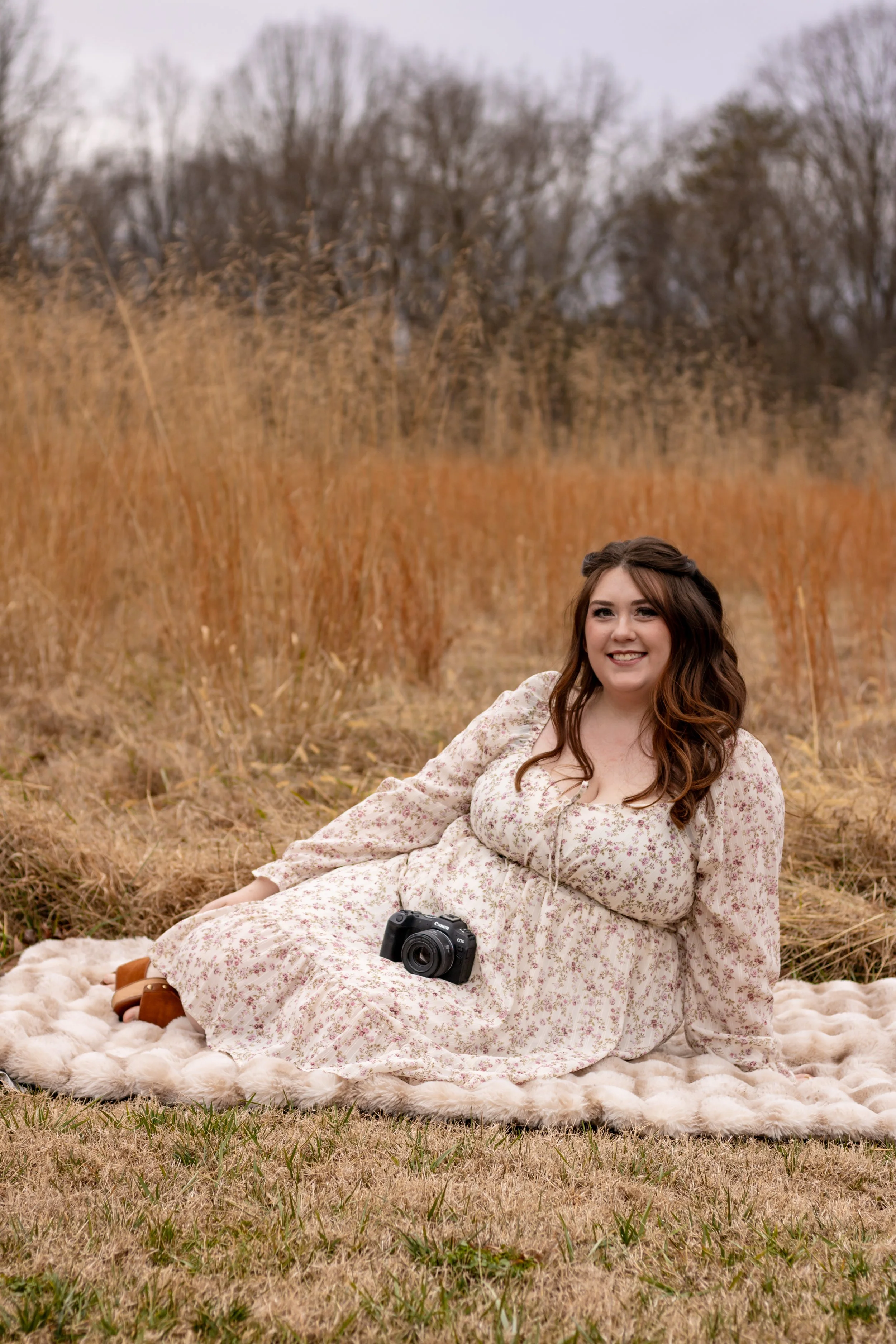 Winston Salem NC Photographer sitting in field at golden hour