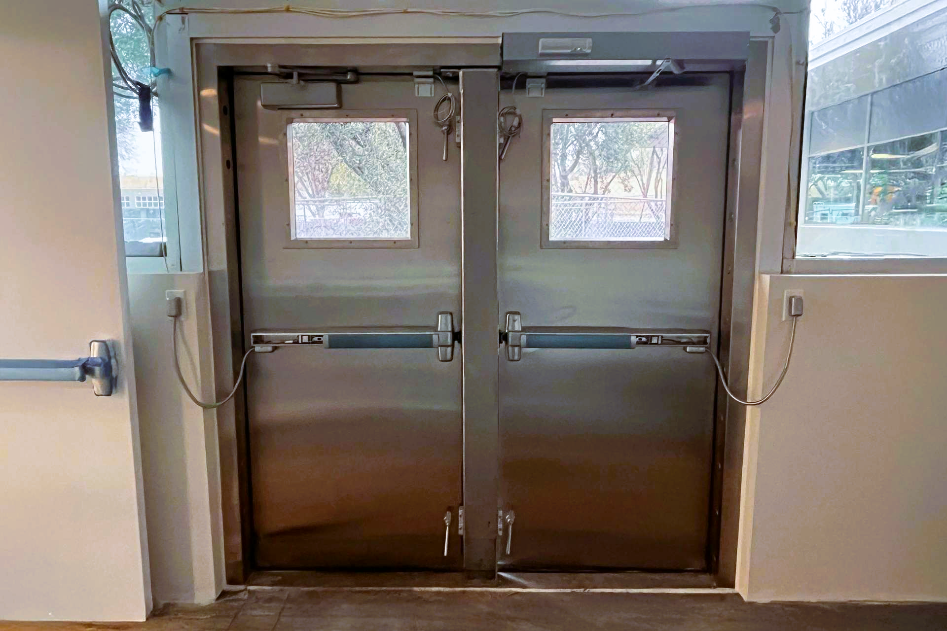 Commercial watertight flood doors installed at institutional facility entrance for FEMA-compliant flood protection.