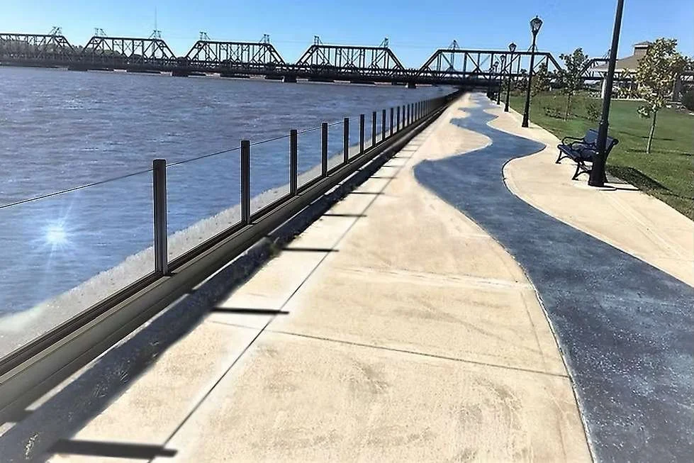 Flood-resistant glass wall assembly engineered for site-specific flood loads and structural integration