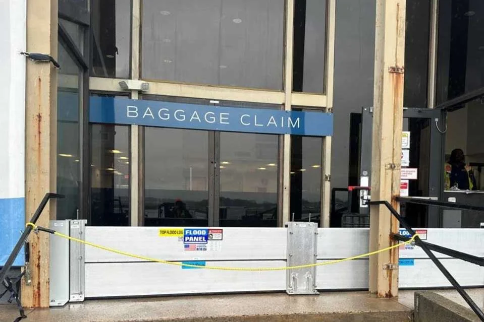 Municipal civic building protected by flood mitigation systems to ensure public service continuity during flood events