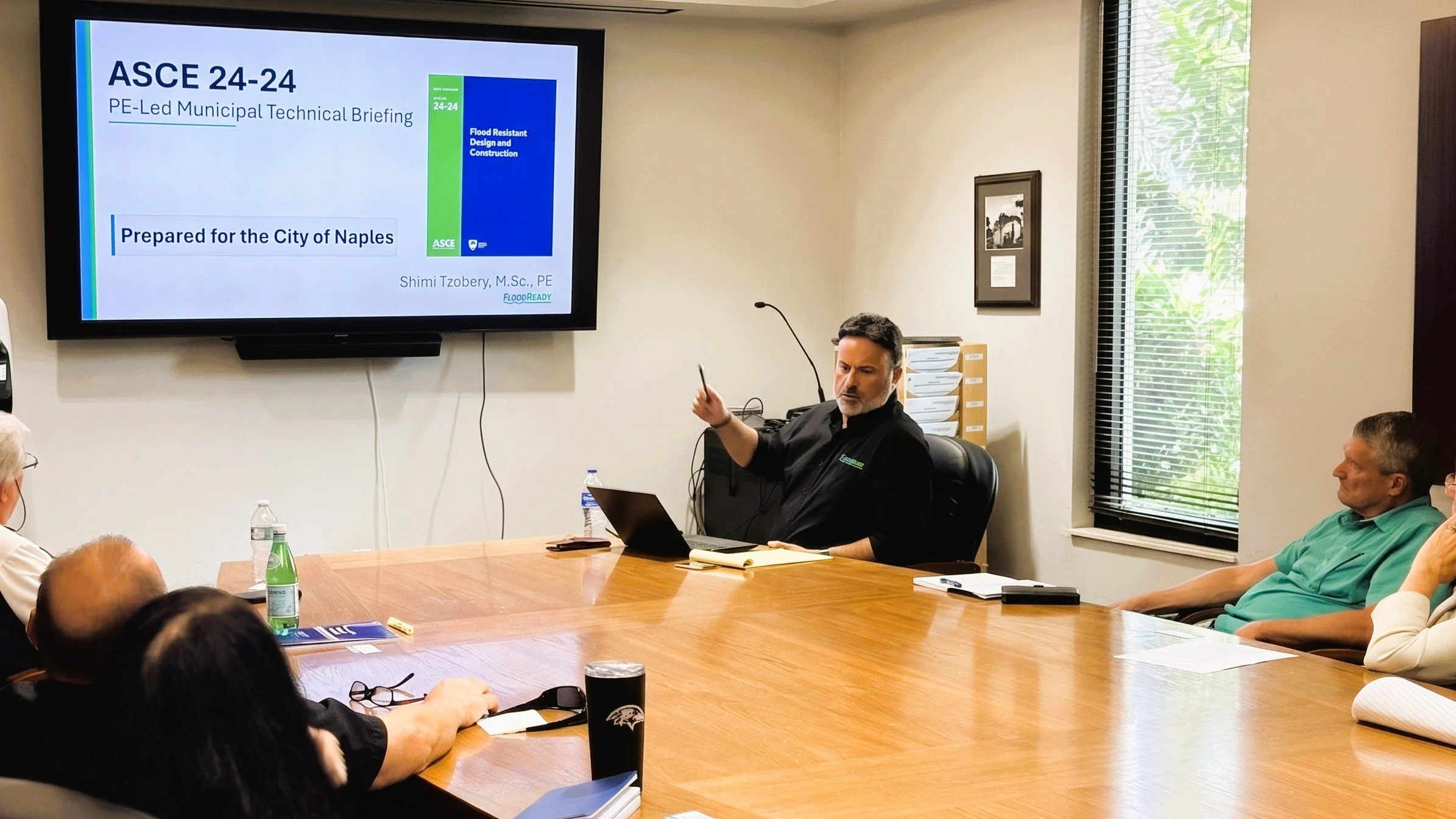 Shimi Tzobery, M.Sc., PE, presenting an ASCE 24-24 technical briefing to the City of Naples Building Department.
