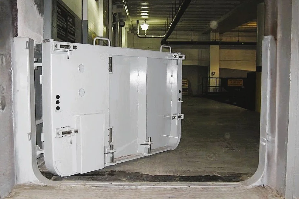 Mechanically operated flood gate installed in essencial facility