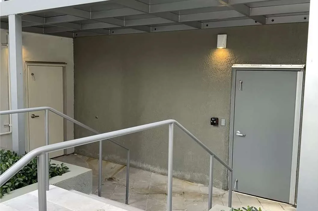 Engineered flood-rated door system installed at commercial facility entrance for code-compliant water protection.