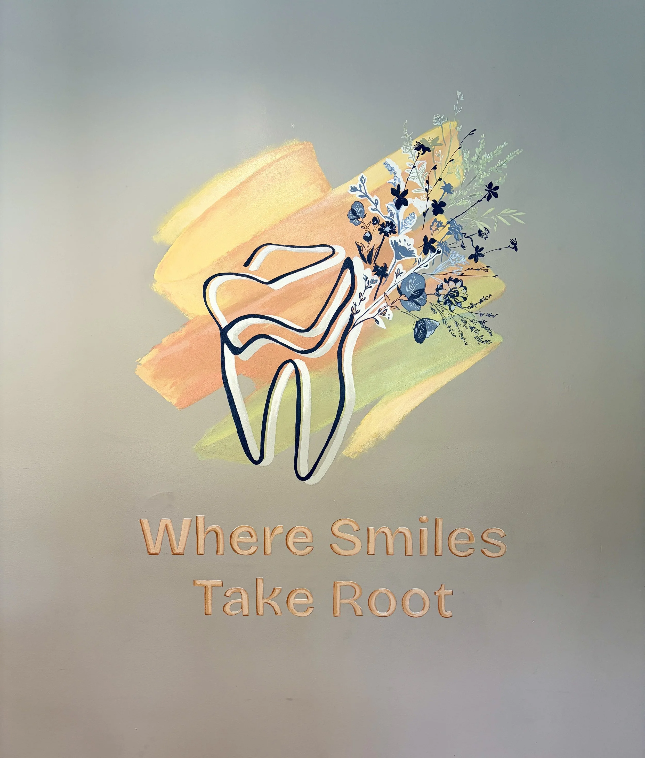 A sign with a stylized outline of a person holding a bouquet of flowers, with the words 'where smiles Take Root' in peach-colored lettering.