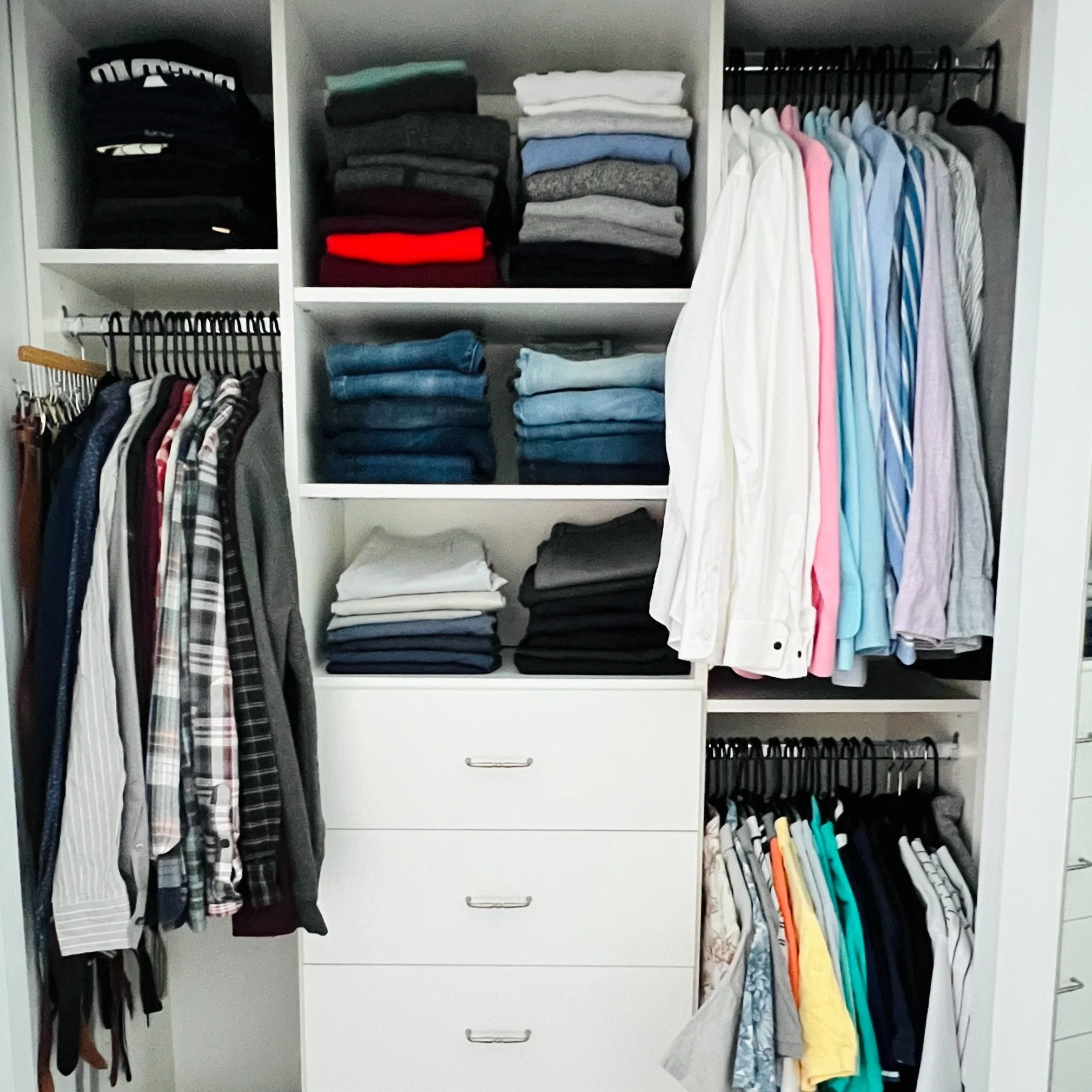 A photo from a closet organizing and stylist session shows an organized closet with shelves holding folded clothes, hanging shirts, and drawers.