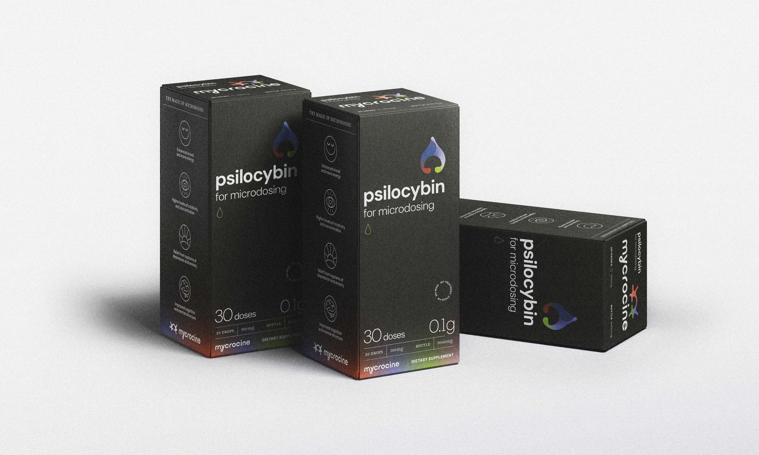 Three boxes of Psilocybin for microdosing by Mycrocyne, with black packaging and colorful droplet logo, positioned against a white background.