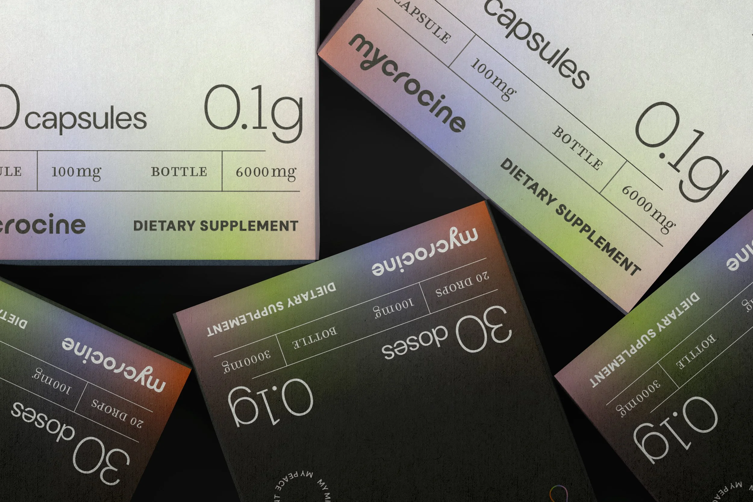 Close-up of multiple boxes of dietary supplement capsules with labels indicating 0.1g capsules, 100mg dosage, and 6000mg bottle size.
