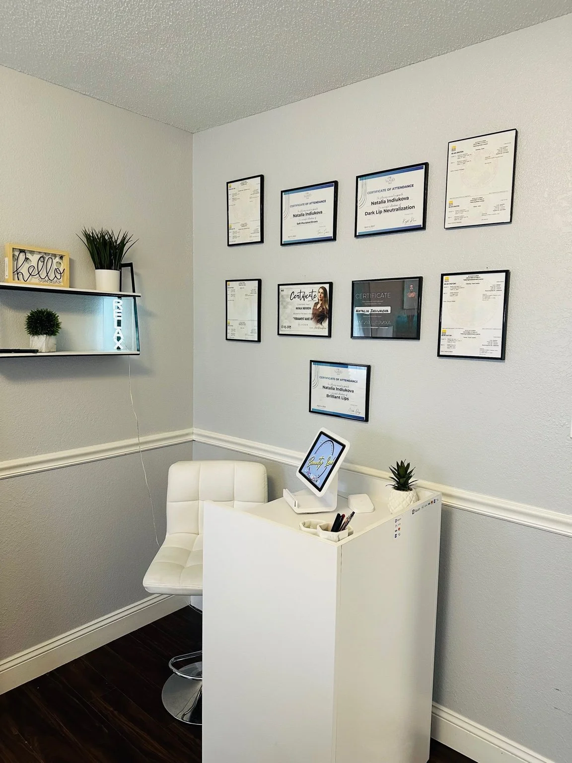 Reception and certification area inside Beauty Lab Destin permanent makeup studio in Destin, Florida.