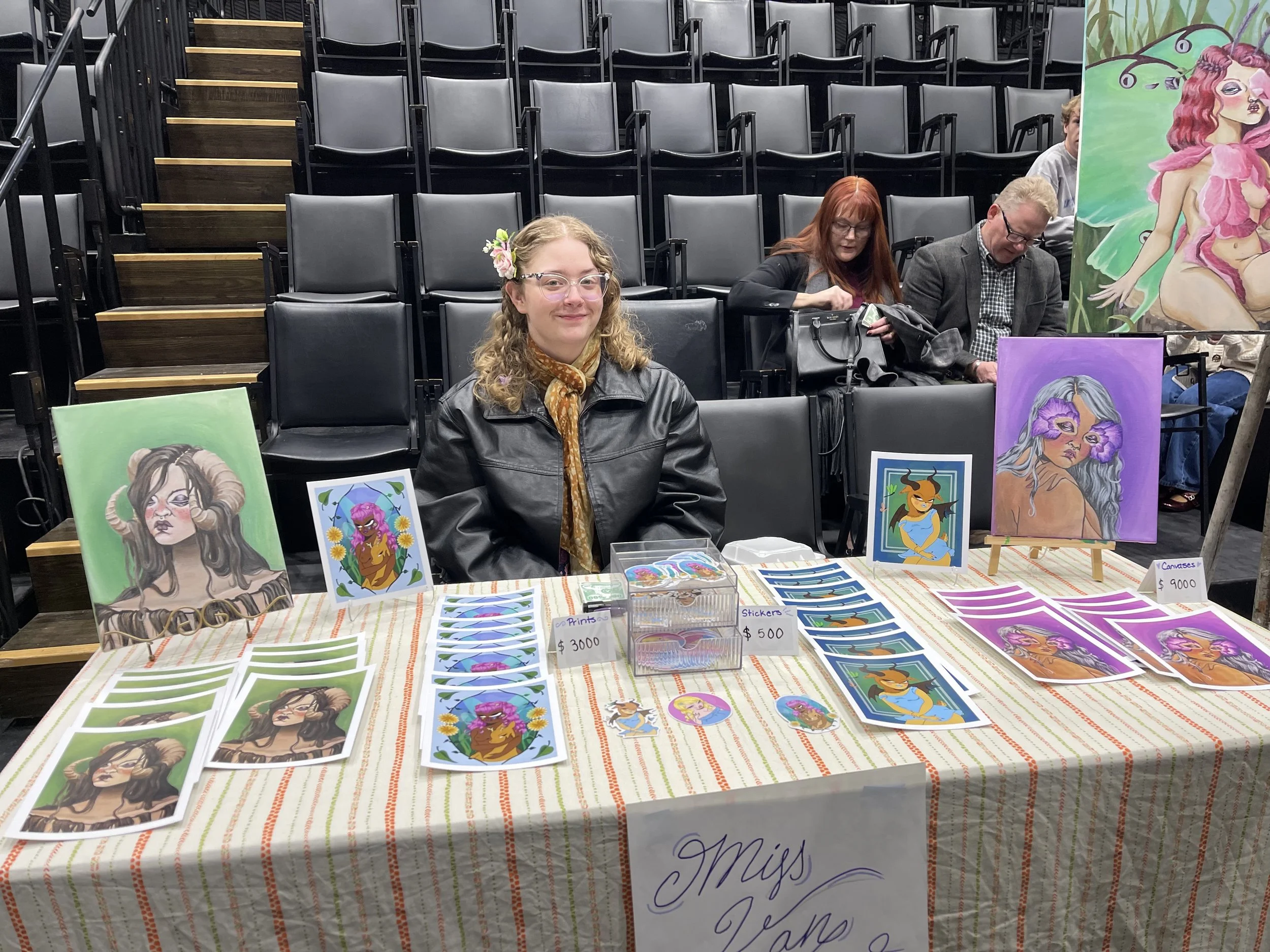 Charity at the Faux Show 2025, selling prints of works inspired by fairy folklore in the style of Miss Van