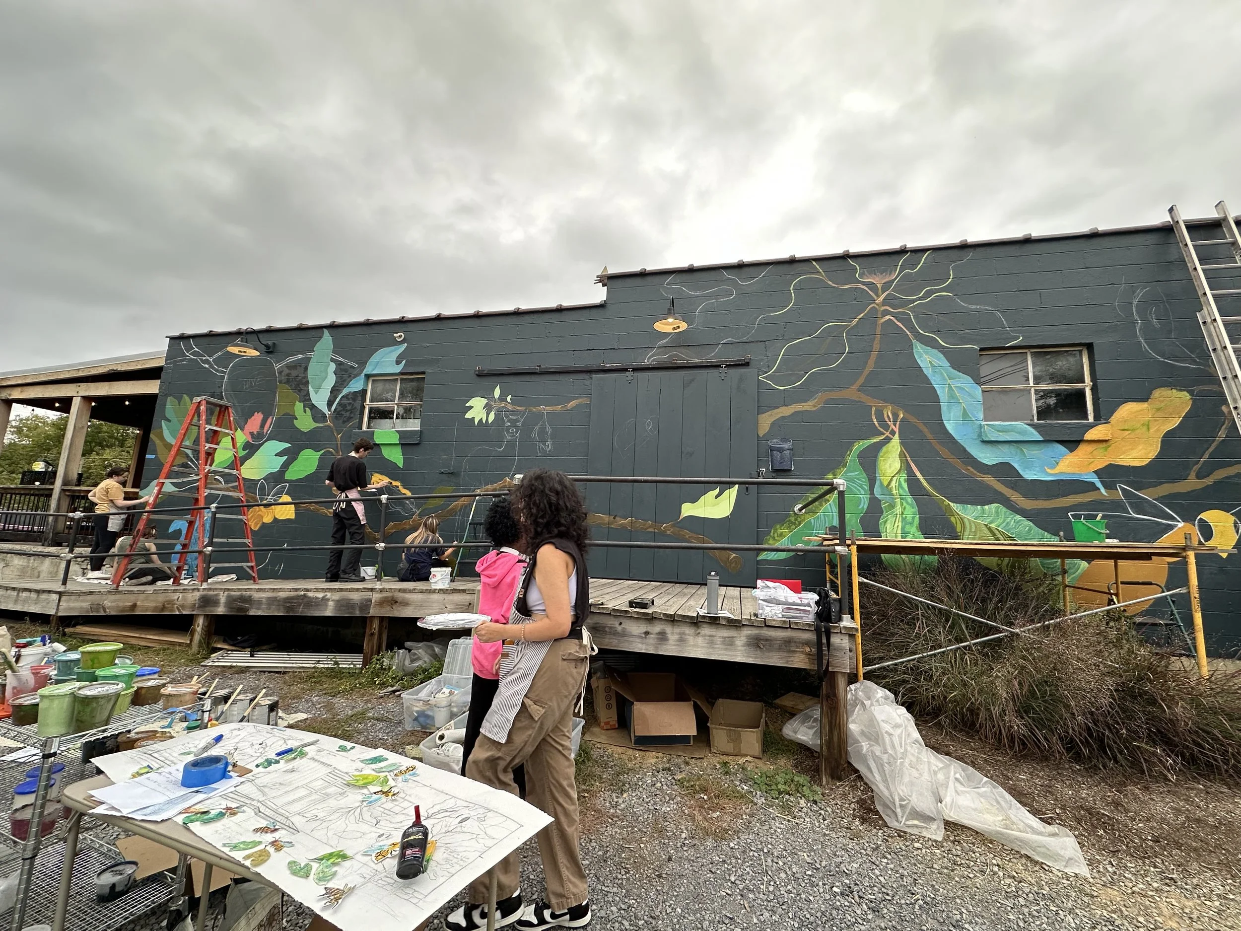 Early progress on the mural with chalk outlines that were hand-drawn from a paper reference.