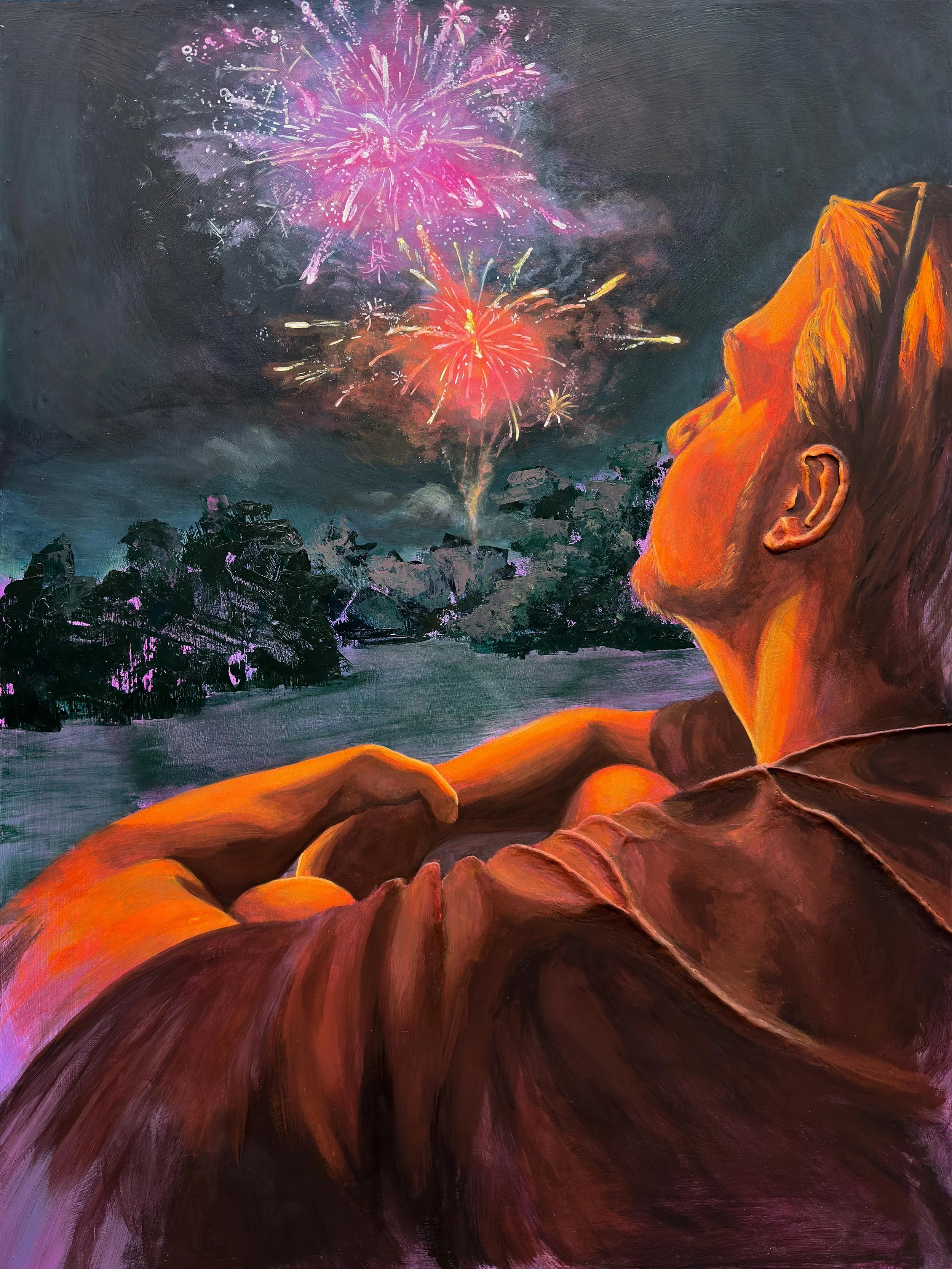 A person is sitting in the foreground, watching abstracted fireworks light up the sky.