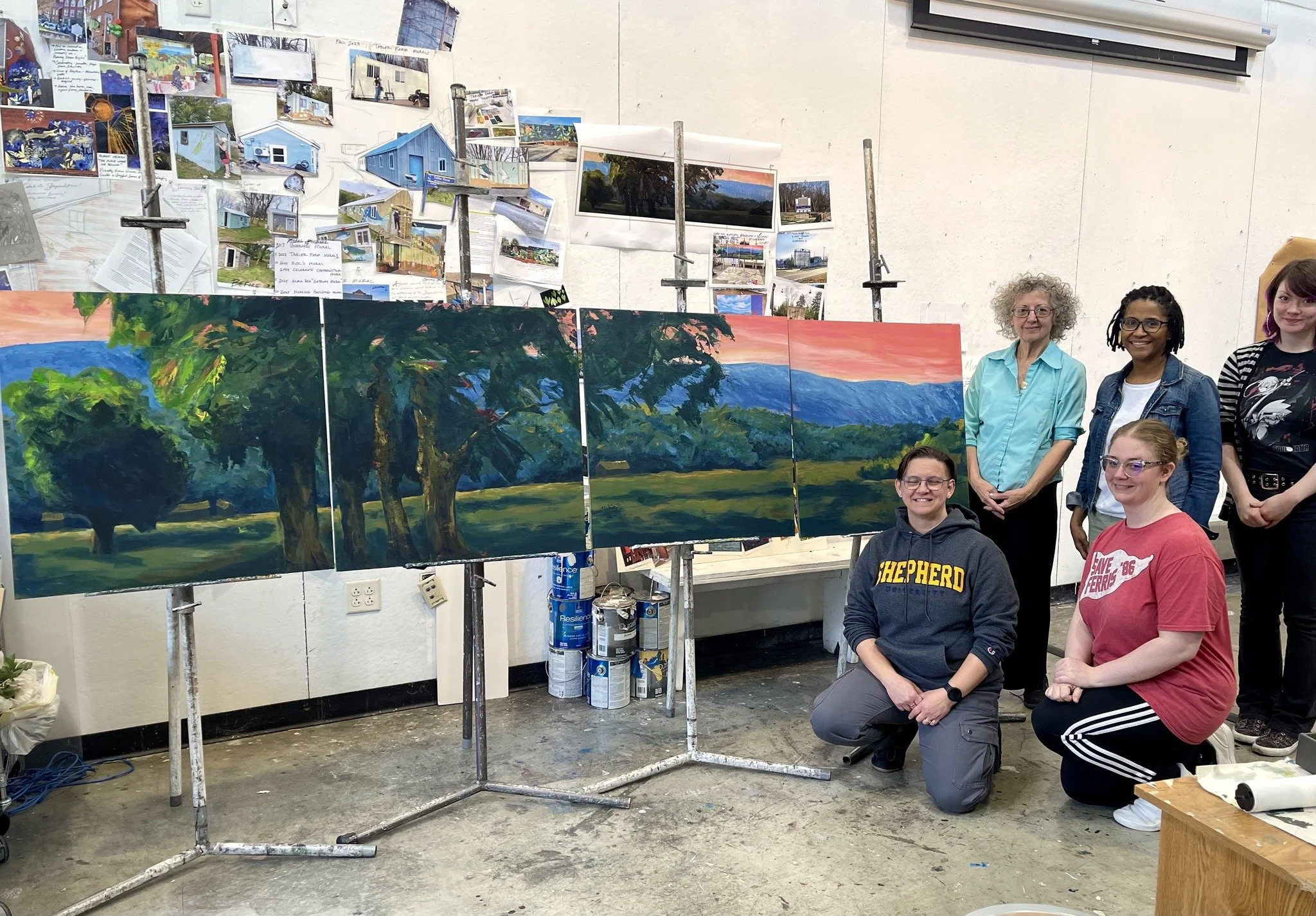 The finished Bridge Gallery Mural with the team and owner.