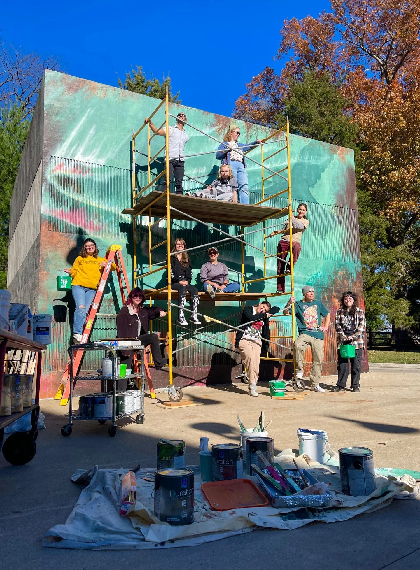 Mural team in front of the Dream Big Mural