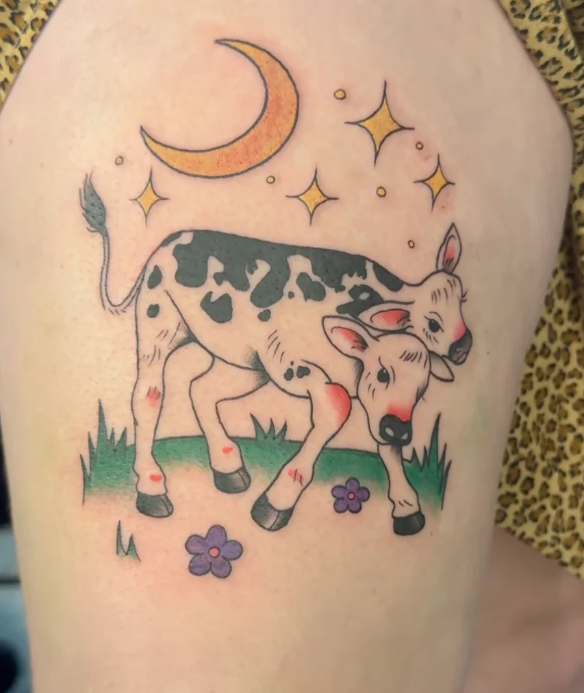 Cute cow tattoo with moon and stars