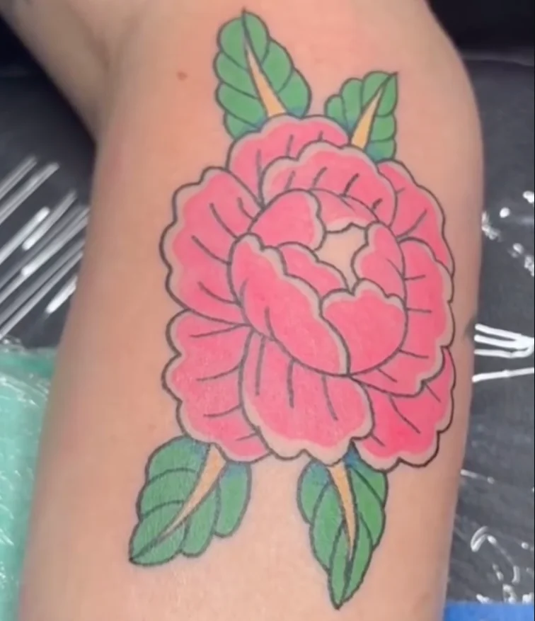 Pink rose tattoo