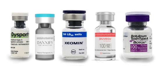 A row of five pharmaceutical vials with different labels and colors.