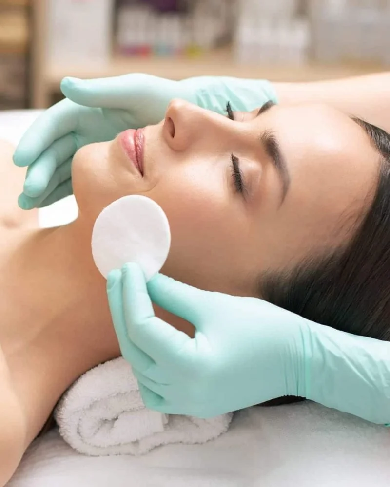 Woman receiving a customized facial treatment at Element Wellness & Aesthetics