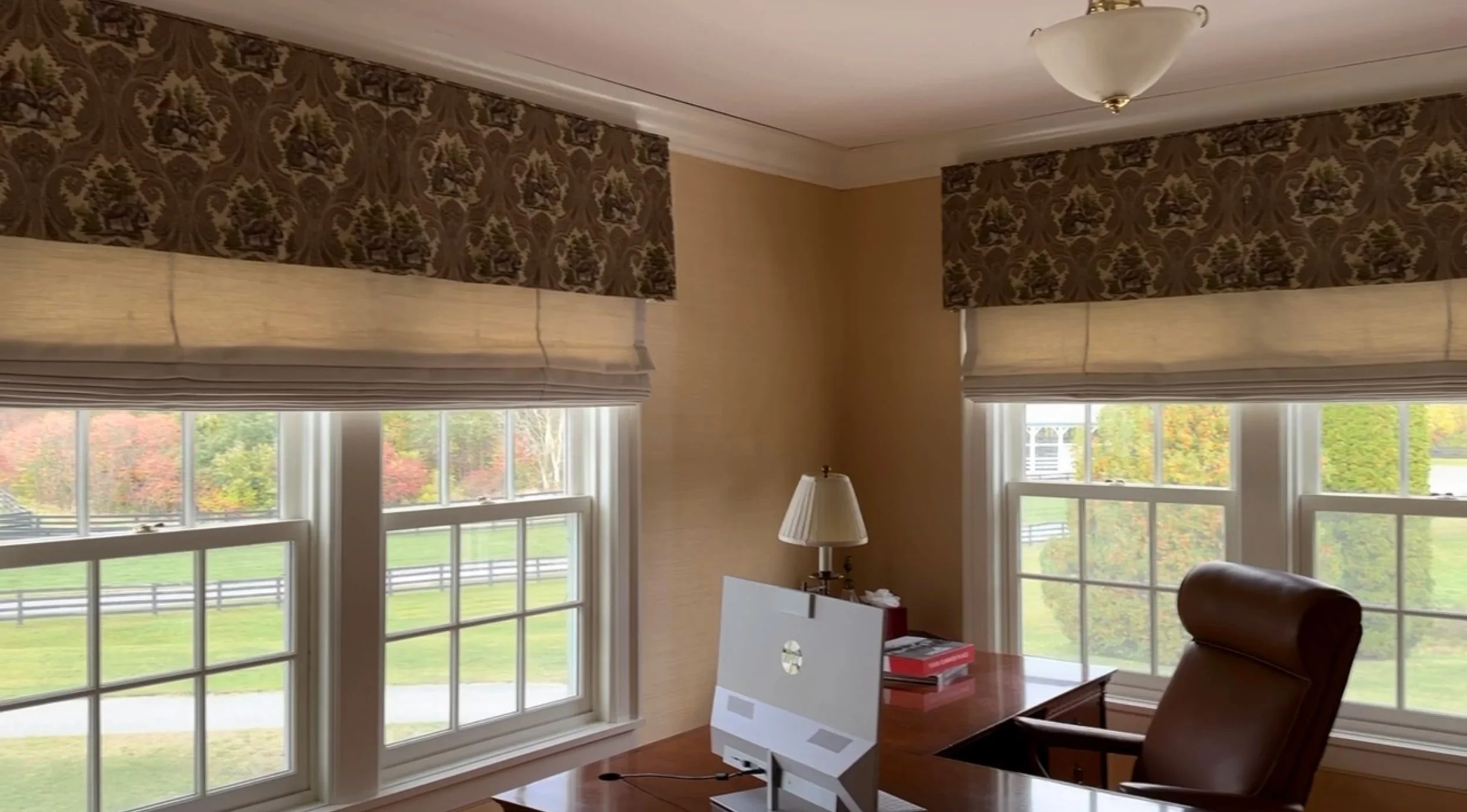 Roman shades with attached contrast valance.