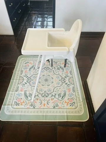 high chair on top of green mess free high chair mat