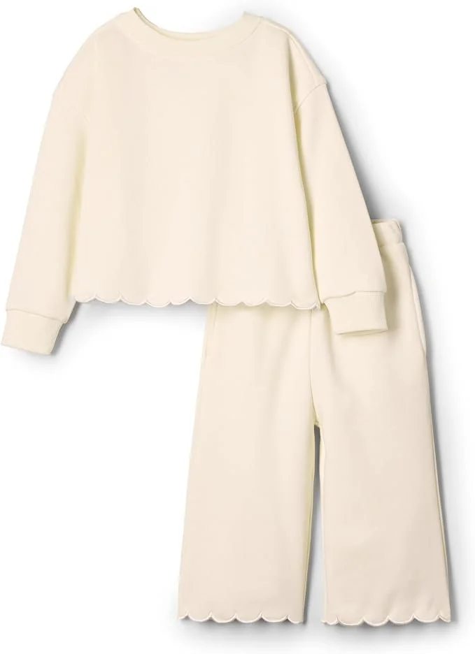 Ivory French terry sweatshirt and wide-leg pants set for toddler girls with scalloped hem.